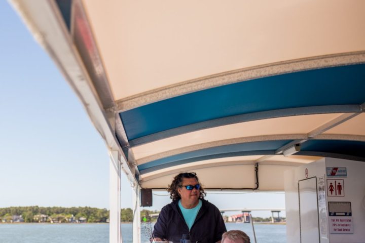 Hilton Head Dolphin Tour Captain Steering Boat